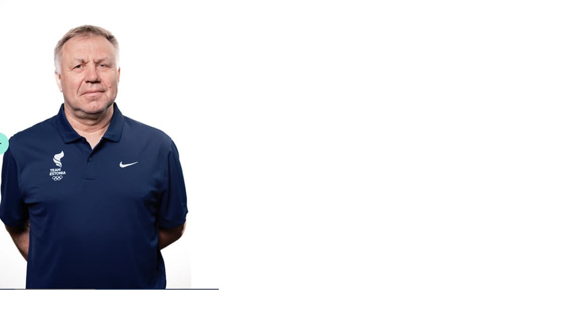 Middle-aged man wearing a navy blue Team Estonia polo shirt against a plain white background.